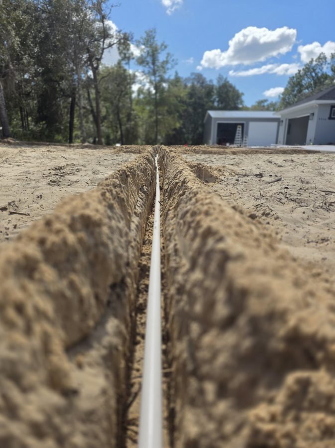 Fresh irrigation trench with main line — Citrus County new construction